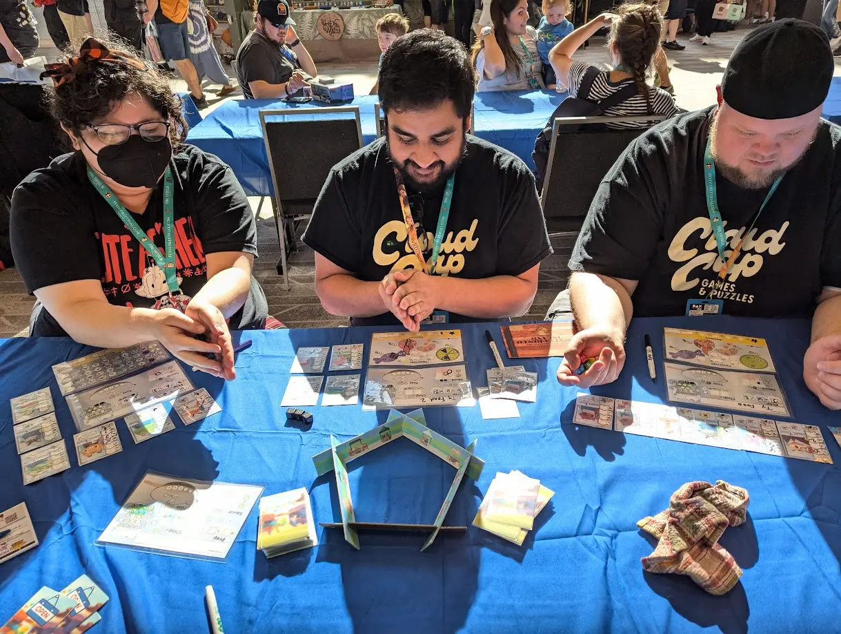 People playing a prototype game of Chicken Fried Dice