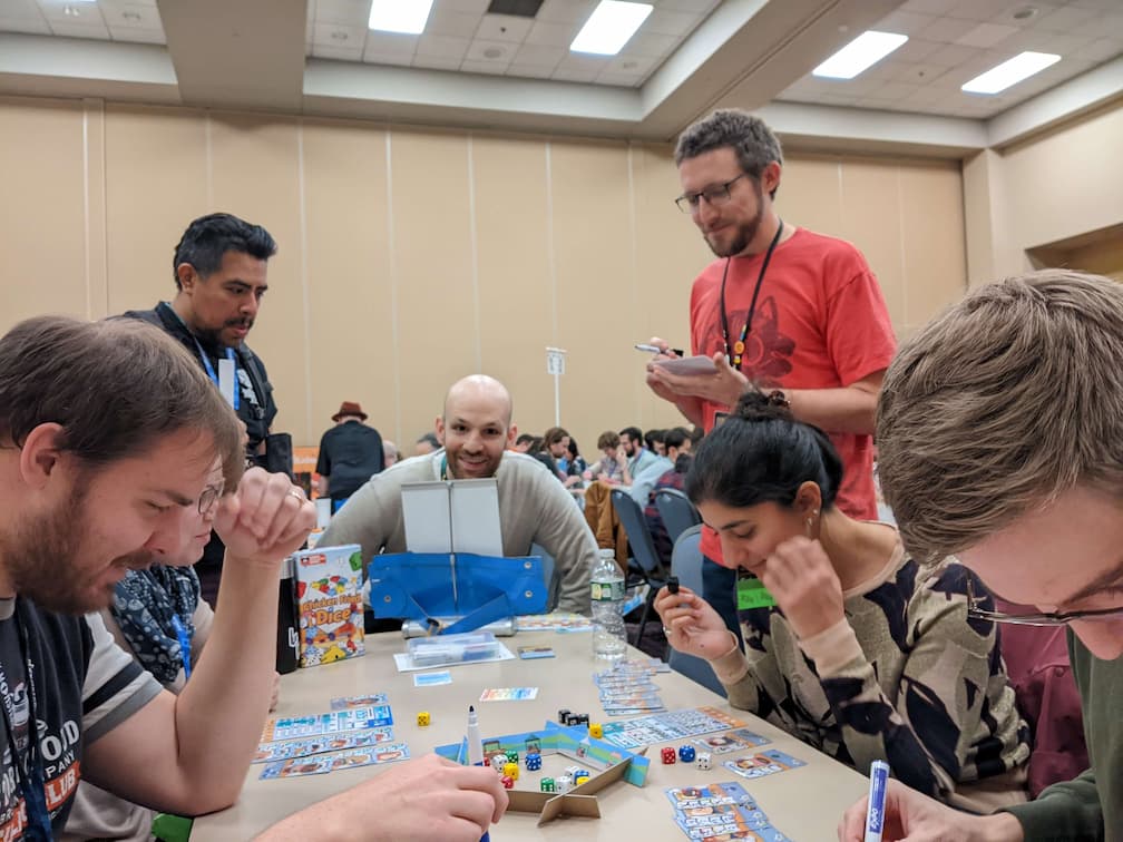 People playing a prototype of Chicken Fried Dice